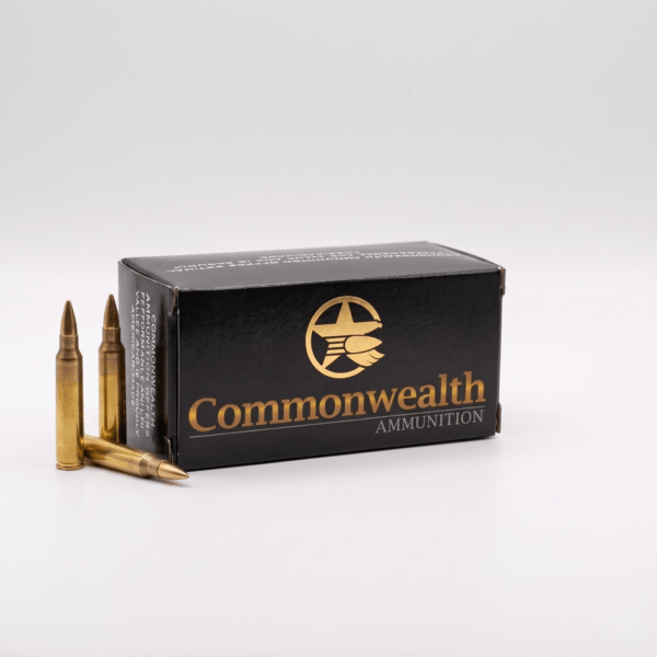 Commonwealth Ammunition .223 Rem 55gr FMJ box and brass rifle cartridges on clean white background