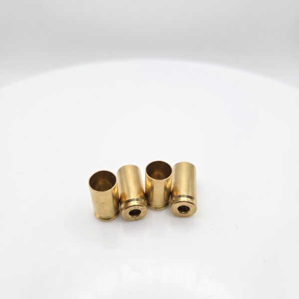 Ready-to-prime: Single Headstamp Processed 9mm Luger brass cases hand-sorted, and polished on a white background.